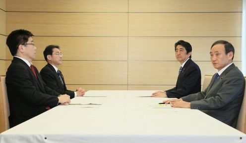 Photograph of the four ministers attending a photograph session