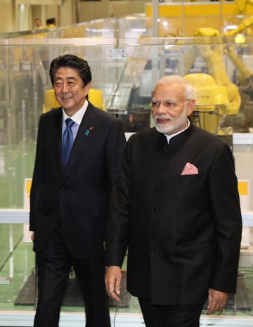 Photograph of the two leaders visiting a company