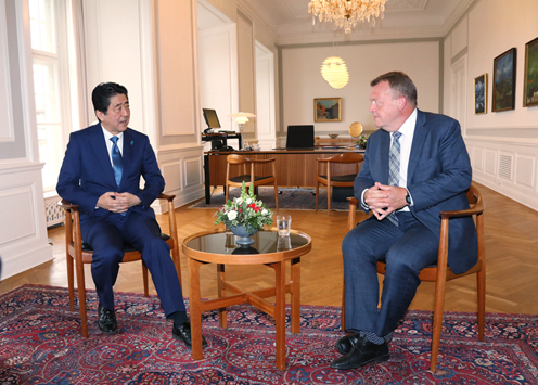 Photograph of the Prime Minister extending his greetings to the Prime Minister of Denmark