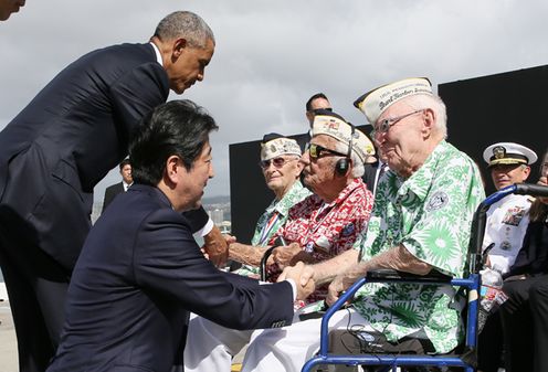 Photograph of the Prime Minister conversing with a participant