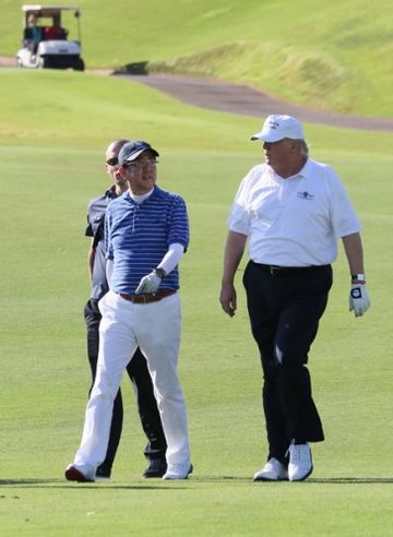Photograph of the leaders playing golf (1)