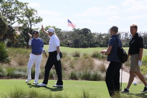 Photograph of the leaders playing golf (2)