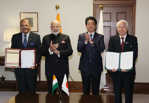 Photograph of the leaders attending the signing ceremony