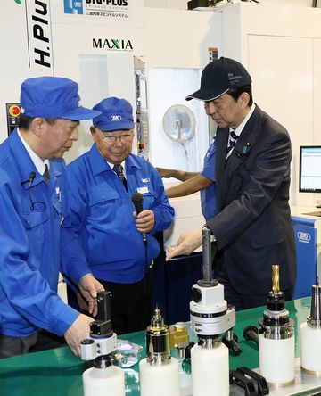 Photograph of the Prime Minister visiting a company