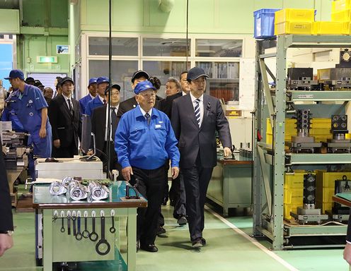 Photograph of the Prime Minister visiting a company