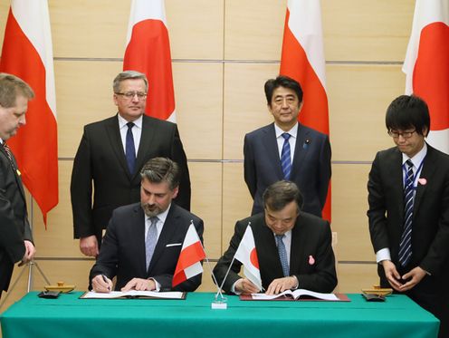 Photograph of the leaders attending the signing ceremony