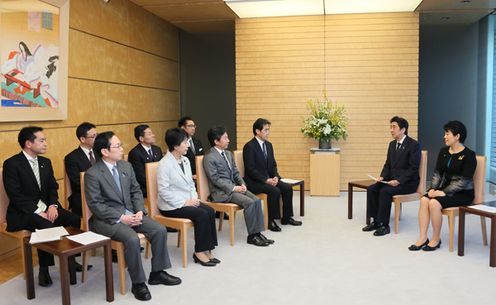 Photograph of the Prime Minister listening to the request