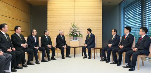 Photograph of the Prime Minister meeting JA Group personnel