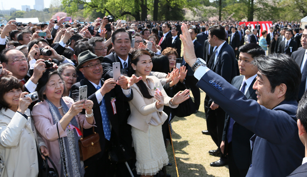 Photograph of the Prime Minister waving at guests