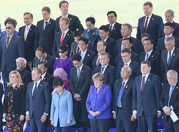 Photograph of the leaders observing a moment of silence for the victims of the incident in Nice, France, during the special program for the Mongolian Nomadic Naadam festival