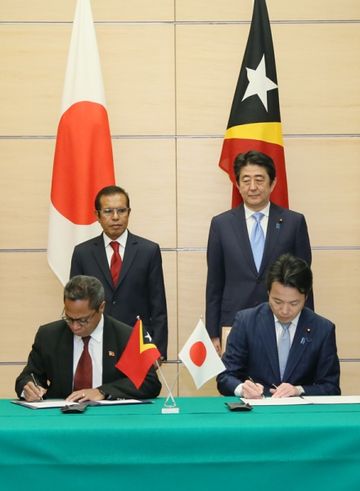 Photograph of the leaders attending the signing ceremony