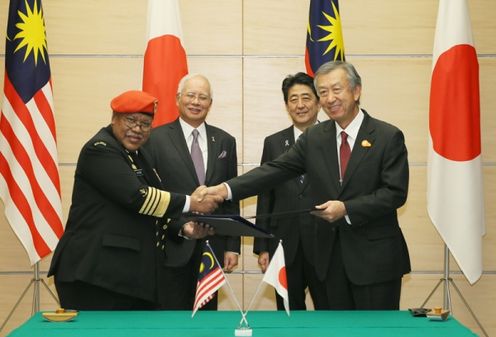 Photograph of the leaders attending the signing ceremony