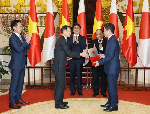 Photograph of the leaders attending the signing ceremony