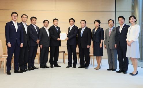 Photograph of the Prime Minister receiving the report