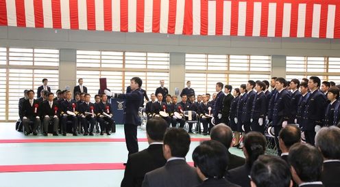 Photograph of the Prime Minister overseeing the graduation ceremony