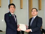 Photograph of the Prime Minister being presented with the recommendations (1)