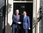 Photograph of the Prime Minister shaking hands with Prime Minister Cameron
