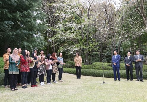 Photograph of the Prime Minister listening to 