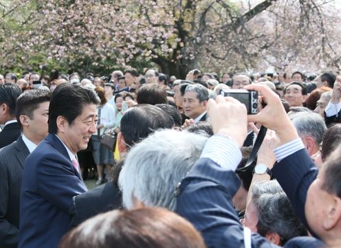 Photograph of the Prime Minister conversing with guests