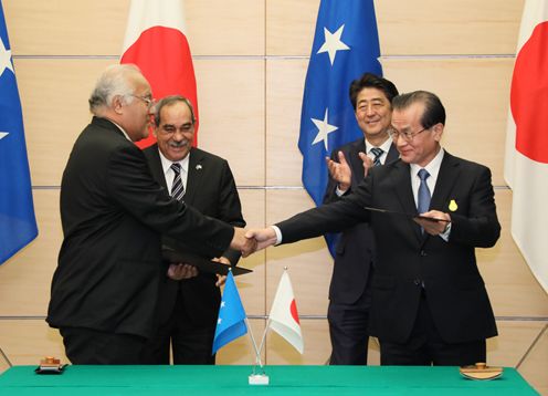 Photograph of the leaders attending the signing ceremony