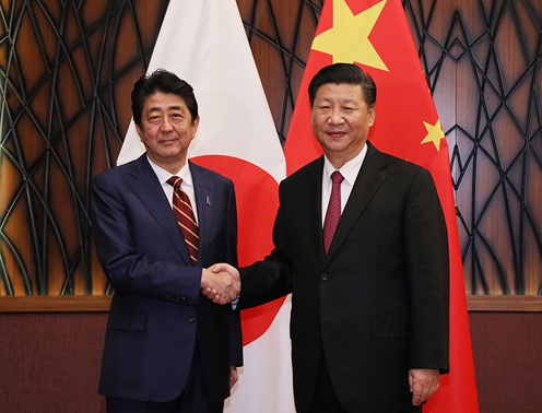 Photograph of the Prime Minister shaking hands with the President of China