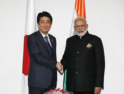 Photograph of the Prime Minister shaking hands with the Prime Minister of India
