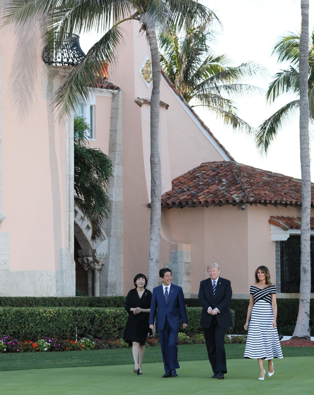 Photograph of the Prime Minister and Mrs. Abe taking a walk with the President and First Lady of the United States