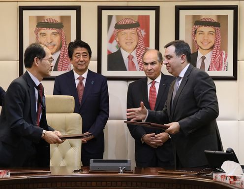 Photograph of the leaders attending the signing ceremony