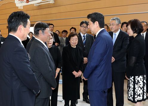 Photograph of the Prime Minister attending a memorial service