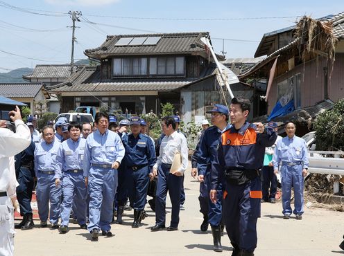 Photograph of the Prime Minister visiting a site affected by flooding