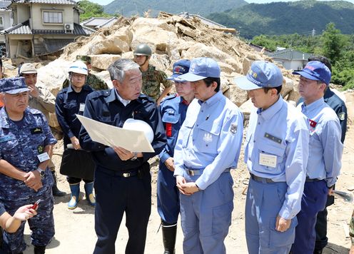 Photograph of the Prime Minister visiting a site affected by landslide