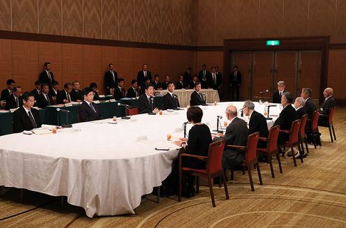 Photograph of the Prime Minister listening to requests from representatives of atomic bomb survivors