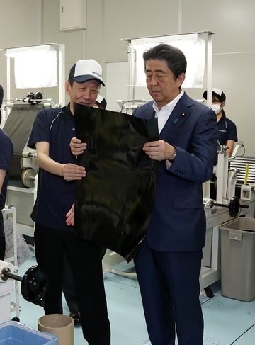 Photograph of the Prime Minister visiting a company