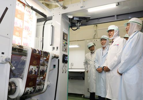 Photograph of the Prime Minister visiting a company