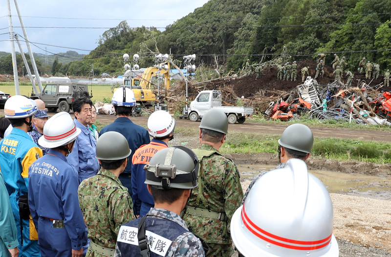 Photograph of the Prime Minister visiting a site affected by a landslide