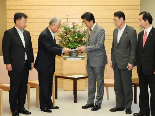 Photograph of the Prime Minister receiving the report