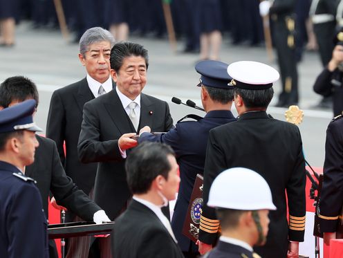 Photograph of the Prime Minister holding an award ceremony