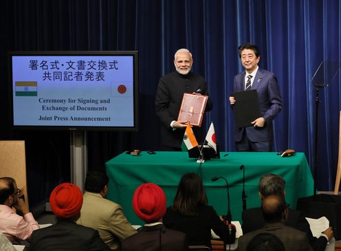 Photograph of the ceremony for signing and exchange of documents