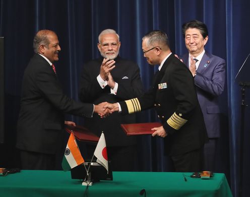 Photograph of the ceremony for signing and exchange of documents