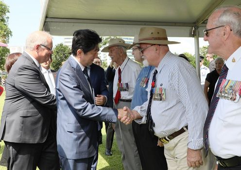Photograph of the Prime Minister shaking hands with Australian veterans