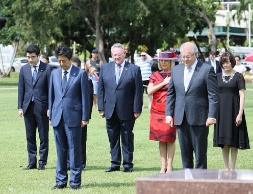 Photograph of the Prime Minister observing a moment of silence at the Darwin Cenotaph