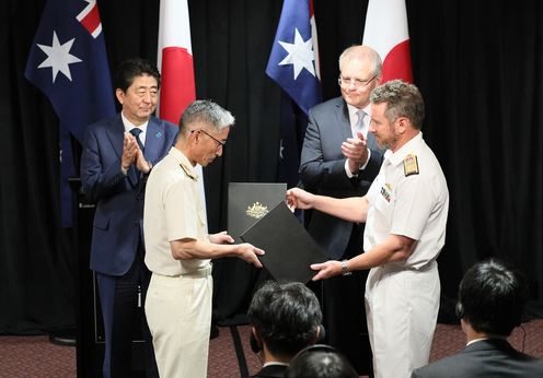 Photograph of the exchange of documents ceremony for Memoranda of Understanding