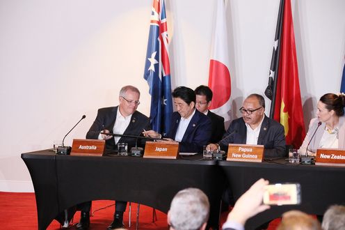 Photograph of the signing ceremony for the joint statement on The Papua New Guinea Electrification Partnership