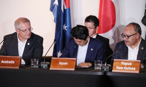 Photograph of the signing ceremony for the joint statement on The Papua New Guinea Electrification Partnership