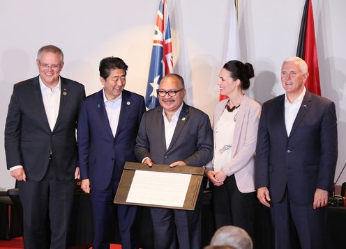 Photograph of the signing ceremony for the joint statement on The Papua New Guinea Electrification Partnership