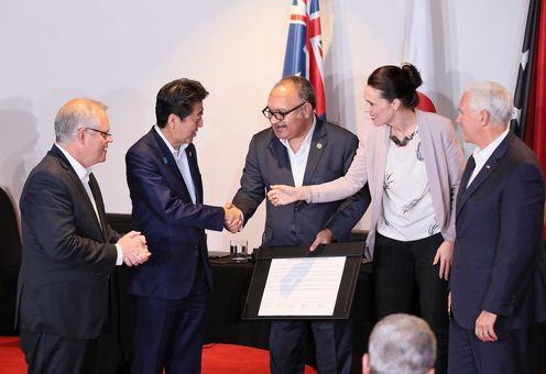 Photograph of the signing ceremony for the joint statement on The Papua New Guinea Electrification Partnership