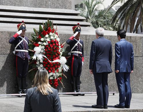 Photograph of the Prime Minister offering flowers at Independence Square