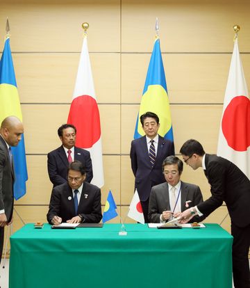 Photograph of the leaders attending the signing ceremony