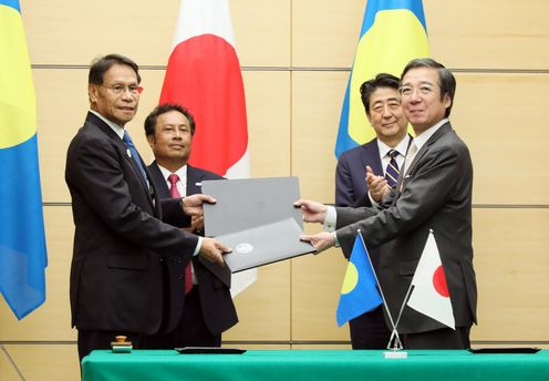 Photograph of the leaders attending the signing ceremony