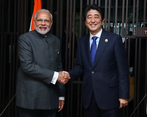 Photograph of the Prime Minister shaking hands with the Prime Minister of India